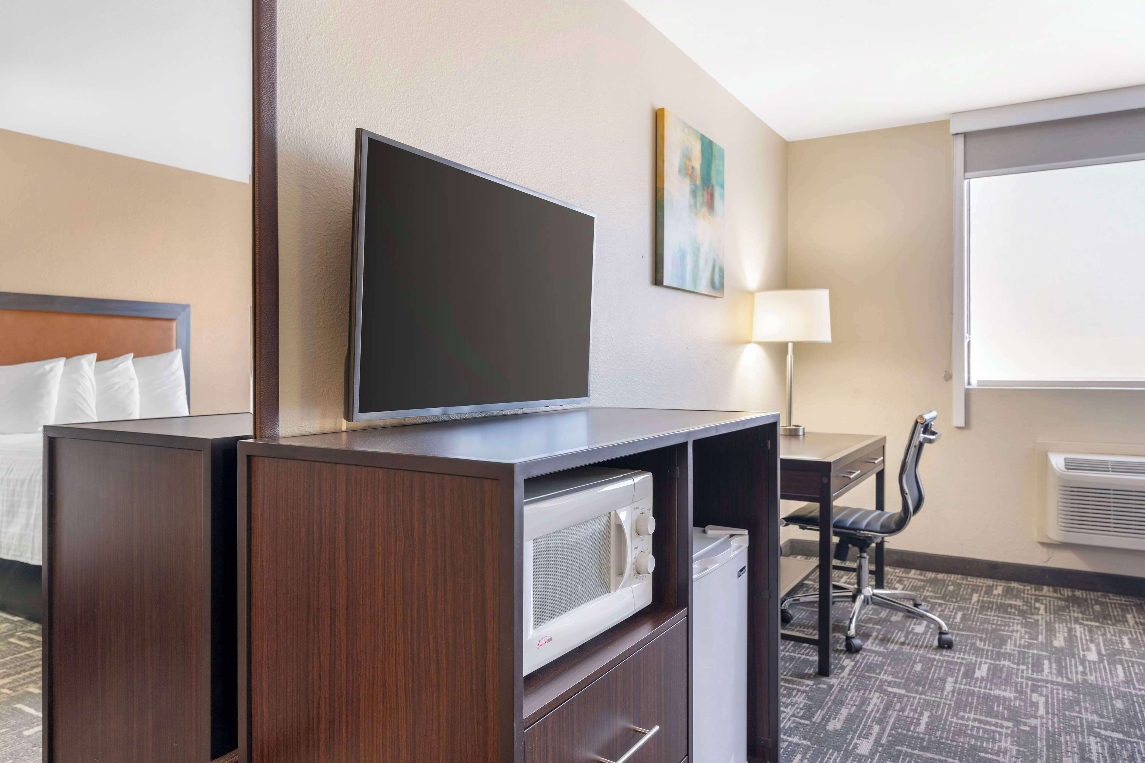 standard room, 2 queen beds, smoking, refrigerator & microwave | desk, laptop workspace, iron/ironing board, wifi