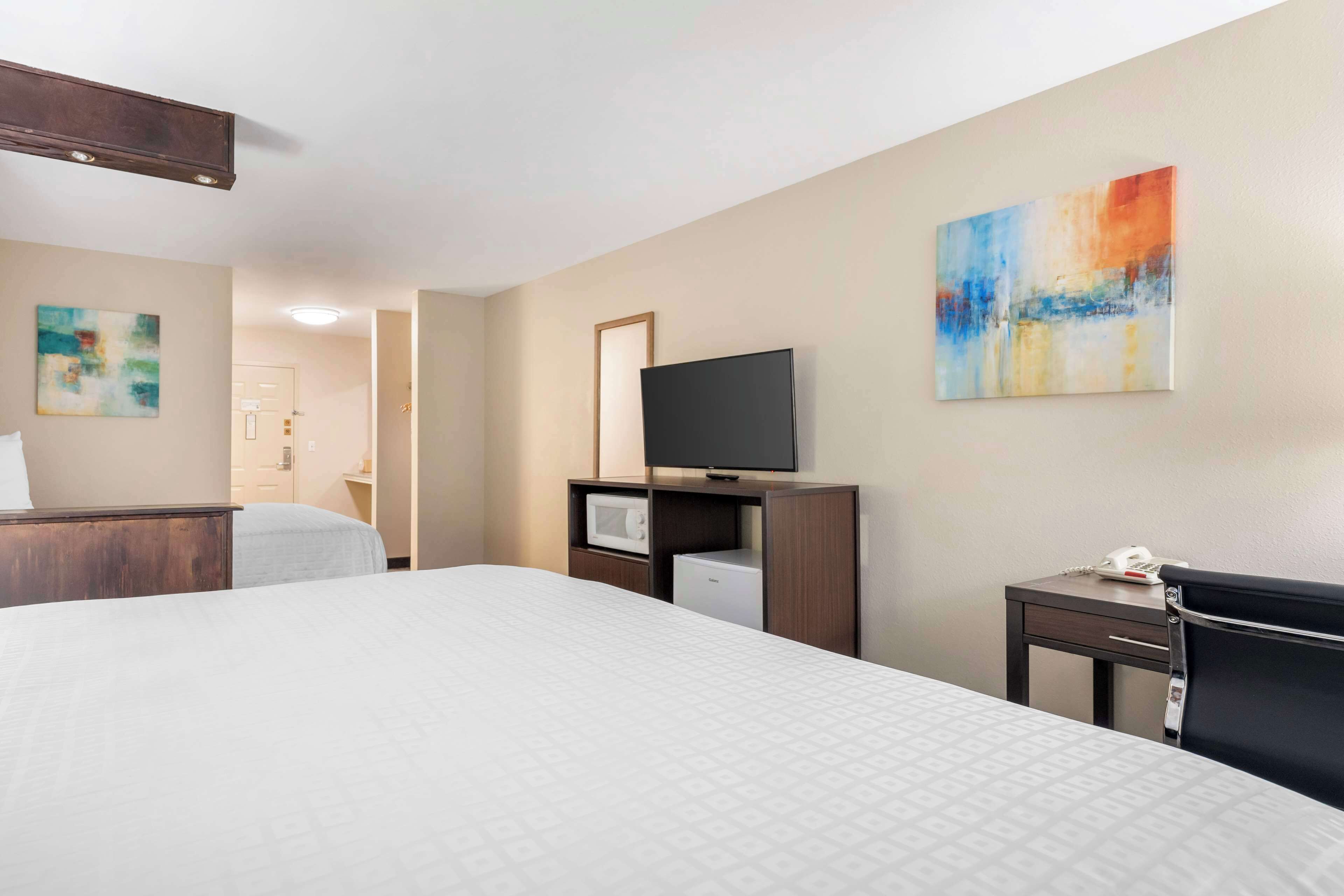 standard room, multiple beds, non smoking, refrigerator & microwave | desk, laptop workspace, iron/ironing board, wifi