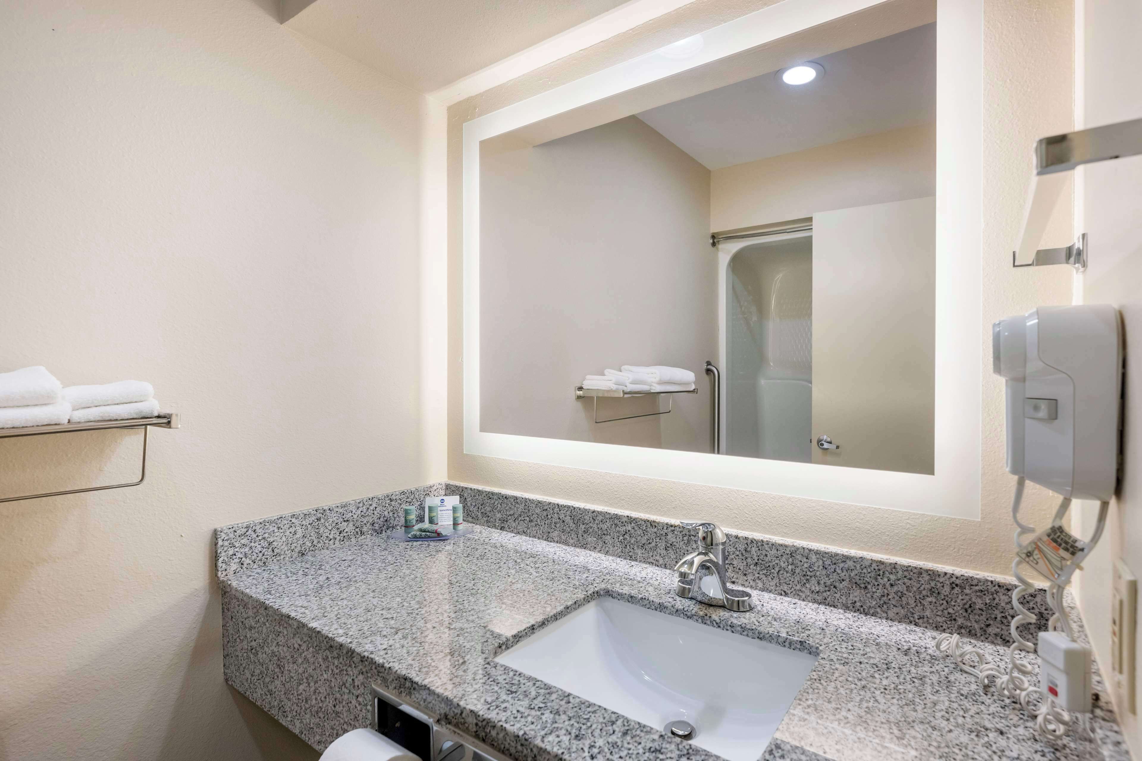 suite, 1 king bed, non smoking, refrigerator & microwave (with single sofabed) | bathroom | combined shower/bathtub, hair dryer, towels, soap