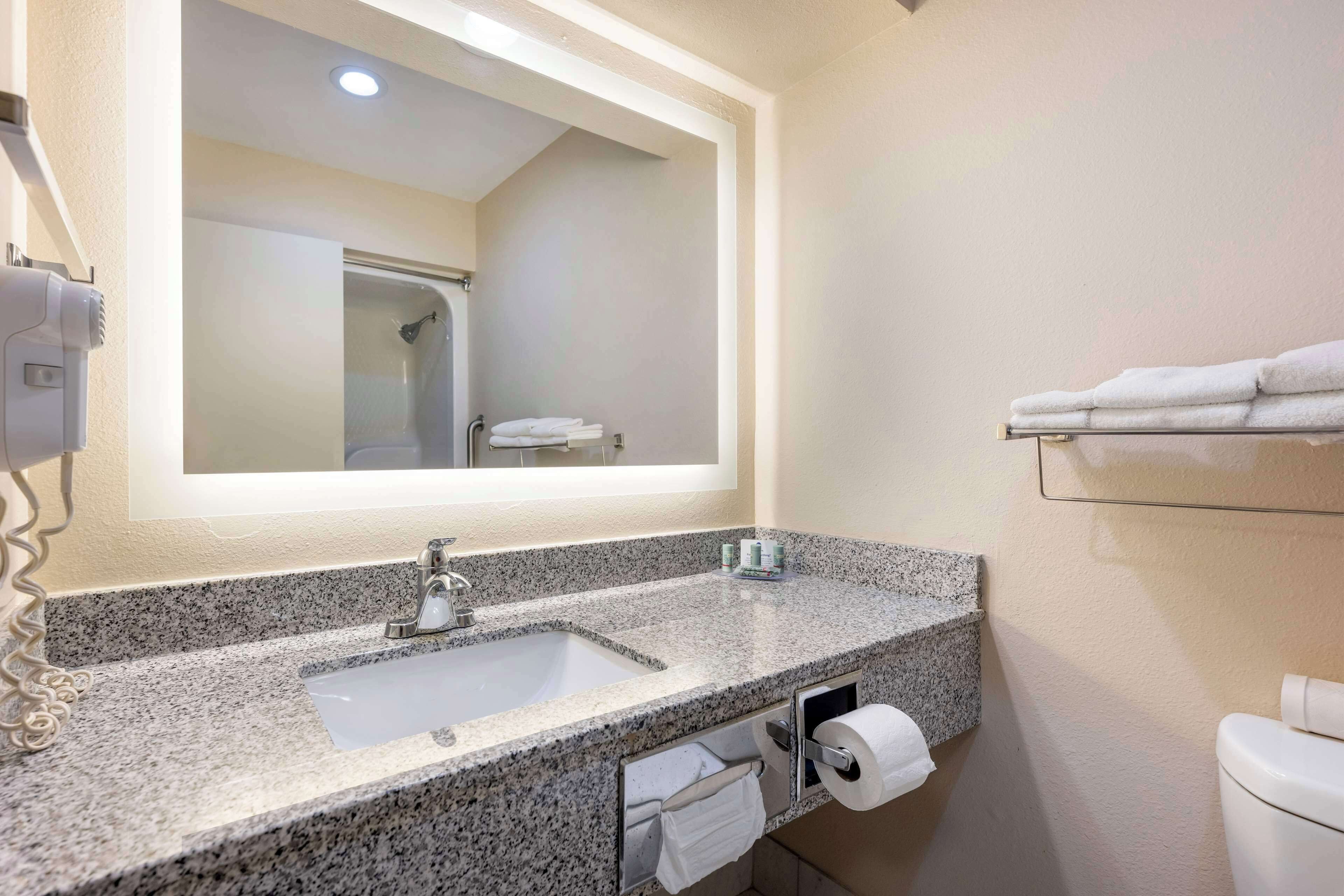 standard room, 2 queen beds, non smoking, refrigerator & microwave | bathroom | combined shower/bathtub, hair dryer, towels, soap