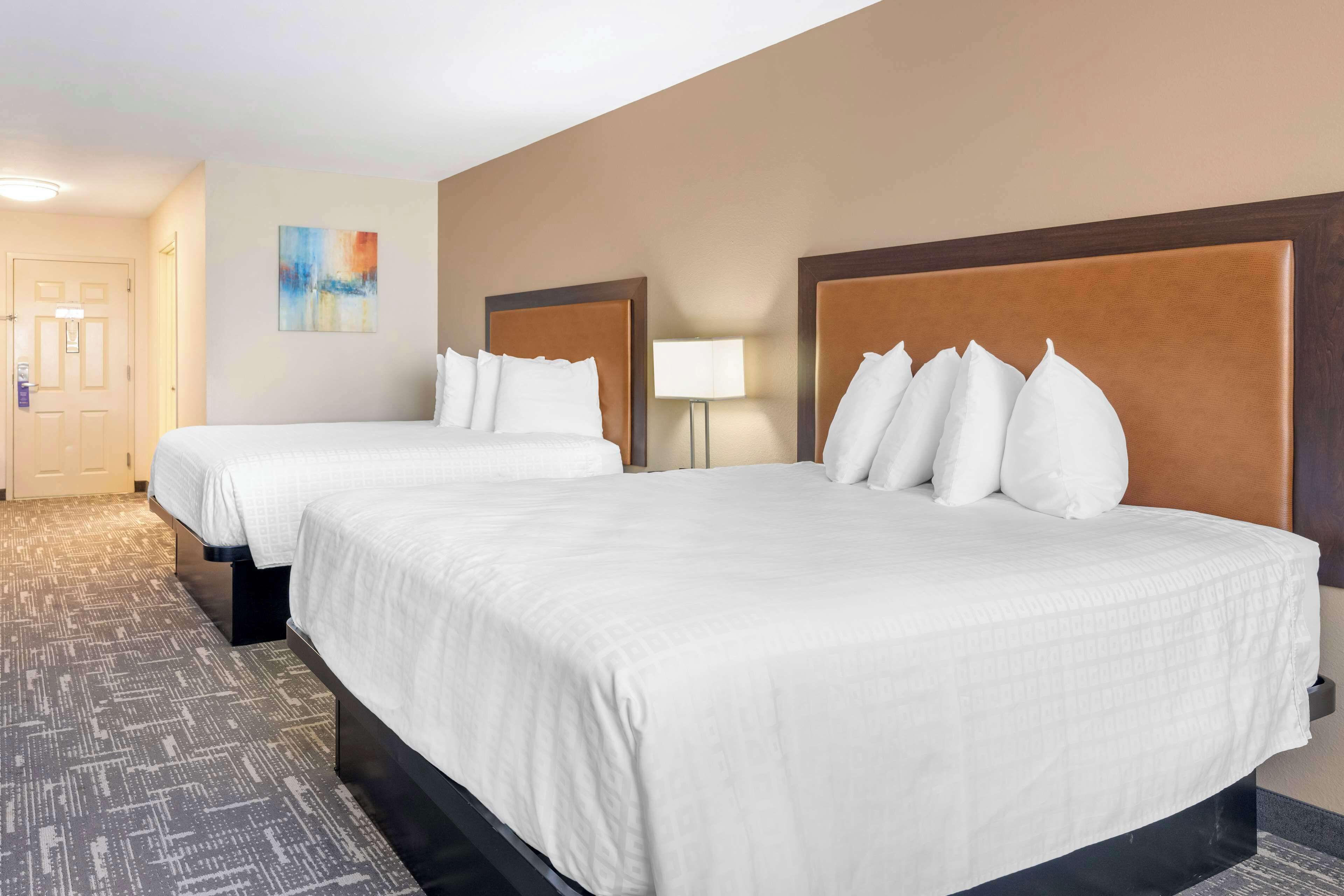 standard room, 2 queen beds, non smoking, refrigerator & microwave | desk, laptop workspace, iron/ironing board, wifi