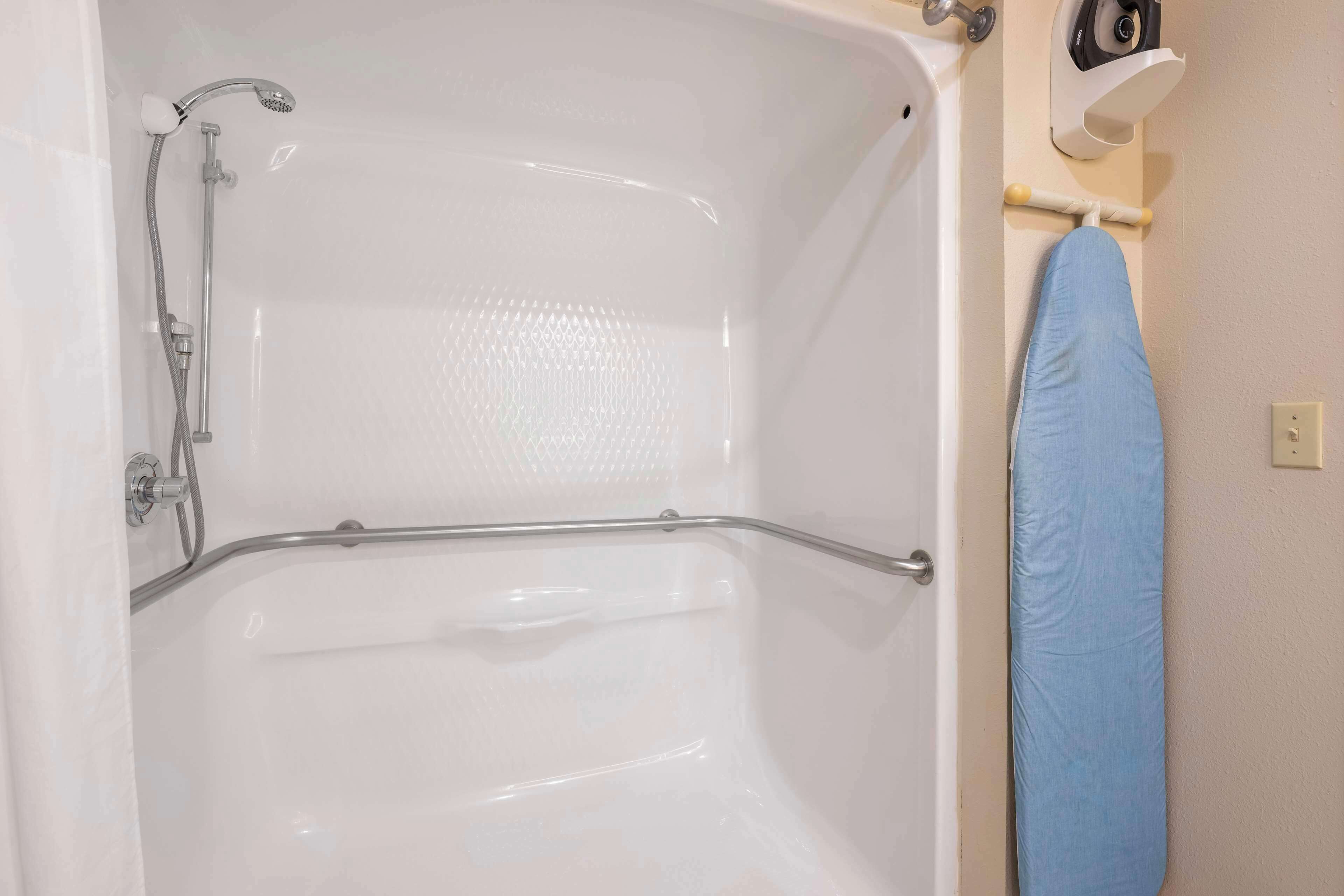 combined shower/bathtub, hair dryer, towels, soap