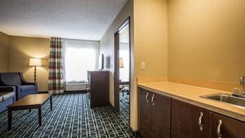 Premium bedding, desk, laptop workspace, iron/ironing board