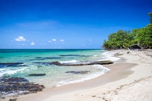 On the beach, white sand, beach towels