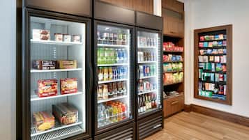 A refrigerated display case with various food items and beverages.