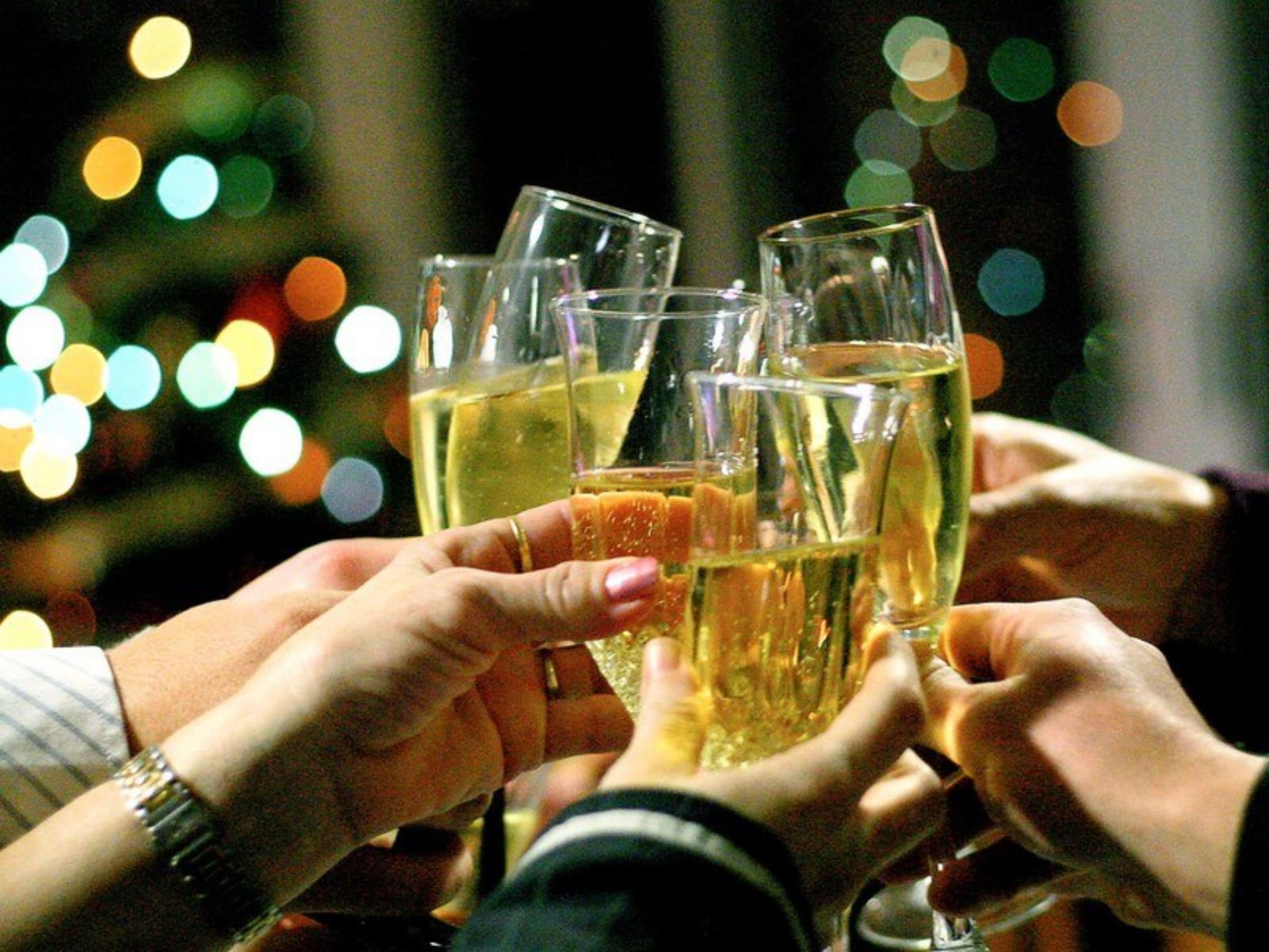 A group of people toasting with champagne glasses.