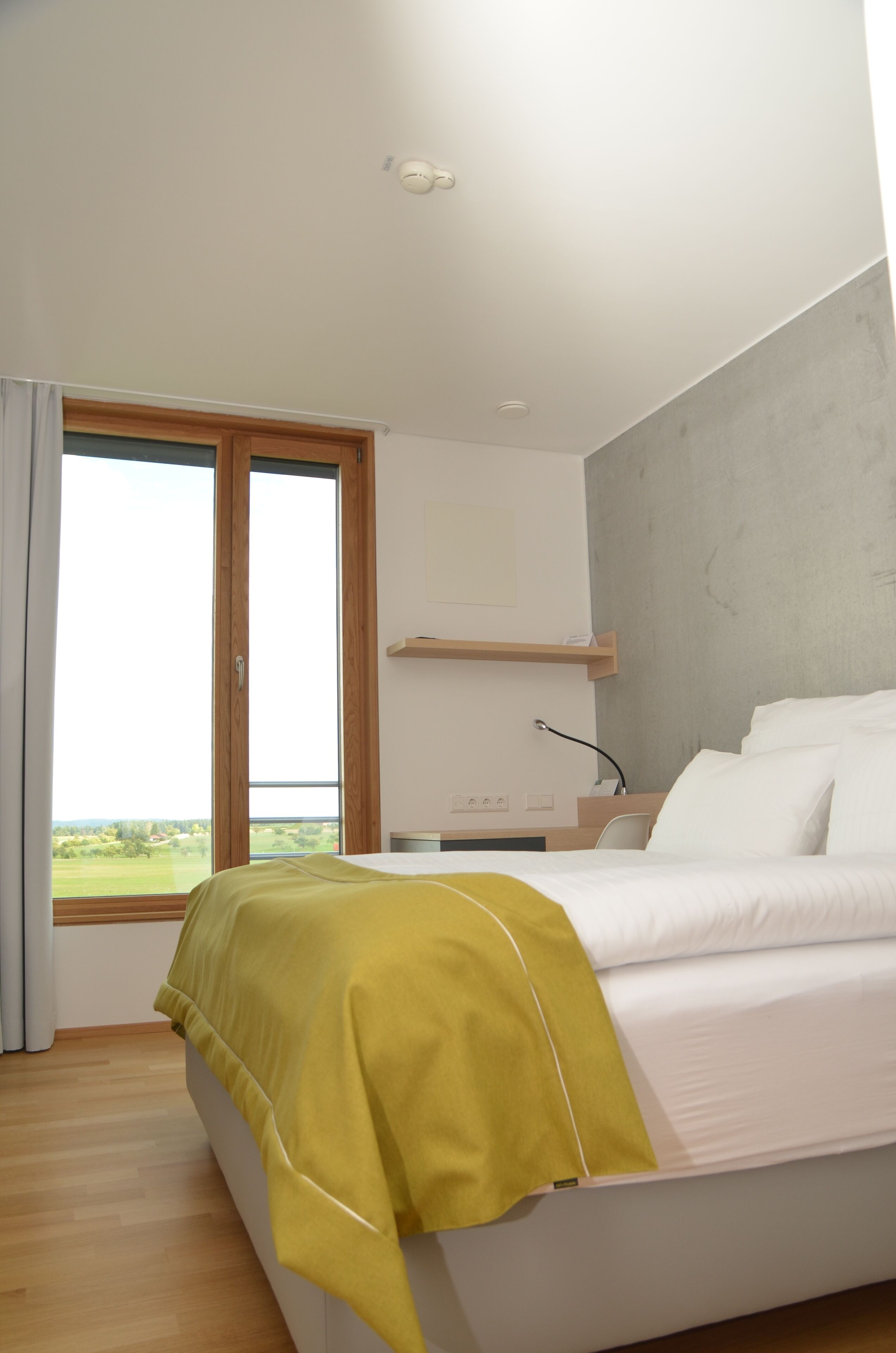 Hypo-allergenic bedding, desk, laptop workspace, blackout curtains