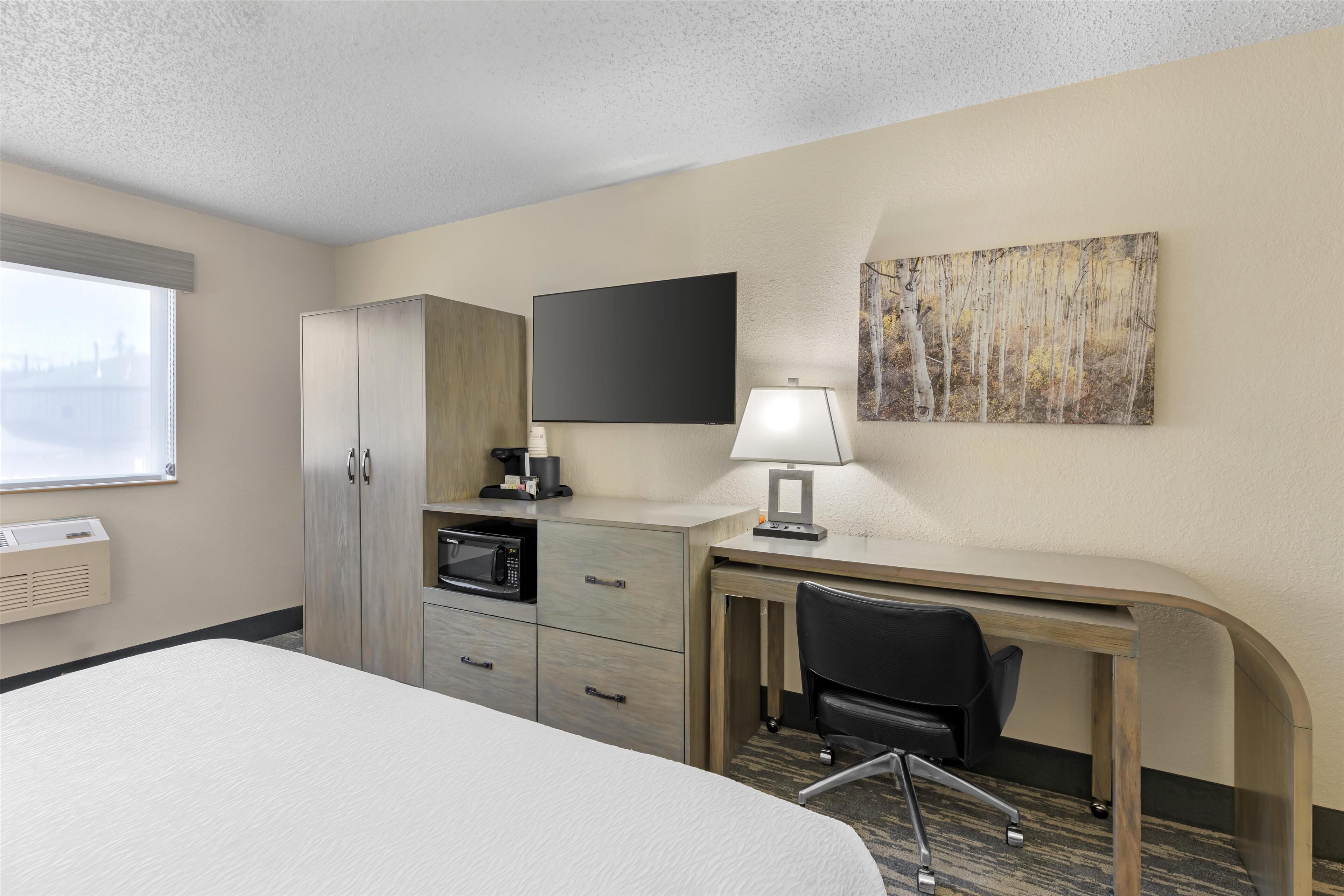 desk, blackout curtains, iron/ironing board, rollaway beds