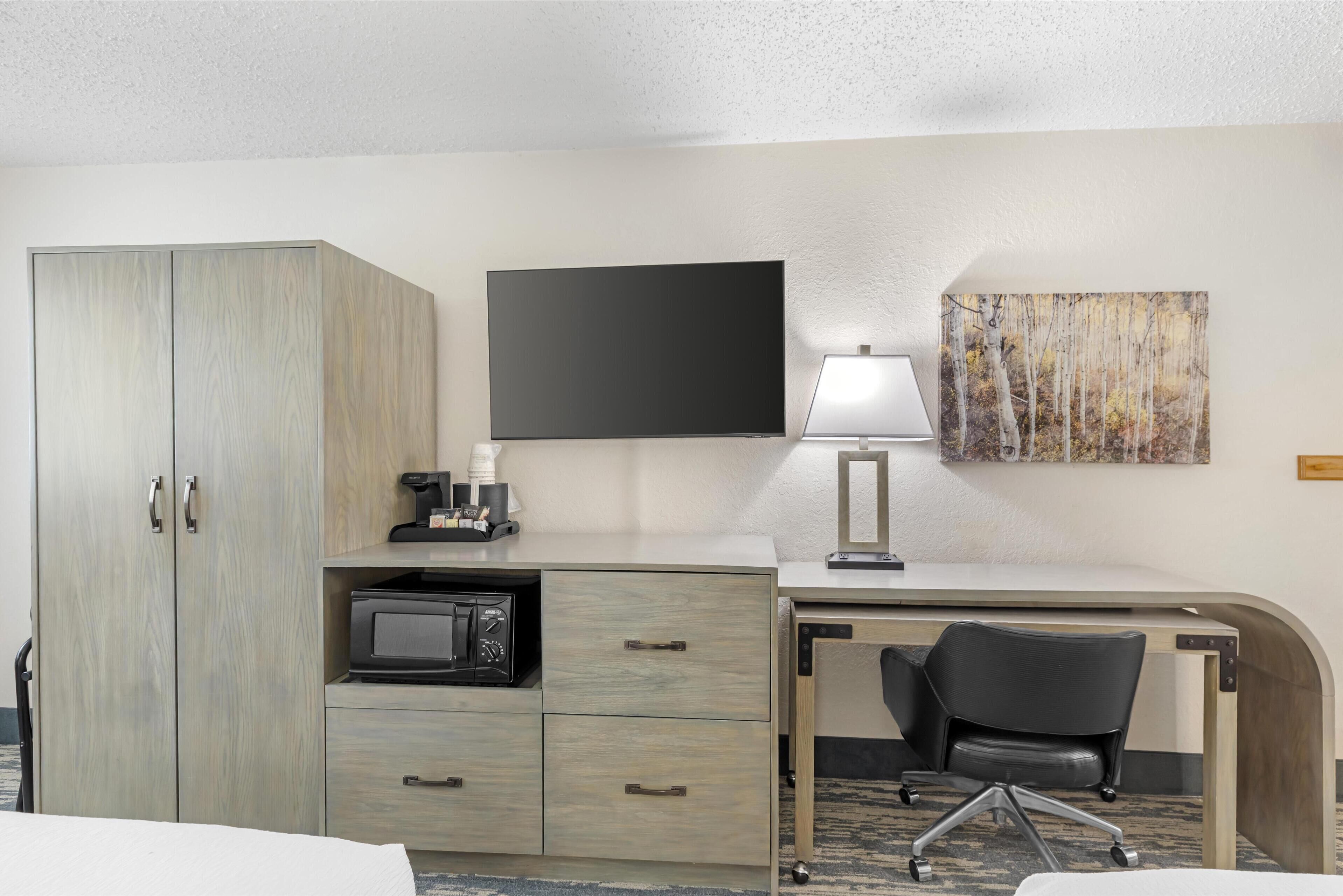 desk, blackout curtains, iron/ironing board, rollaway beds