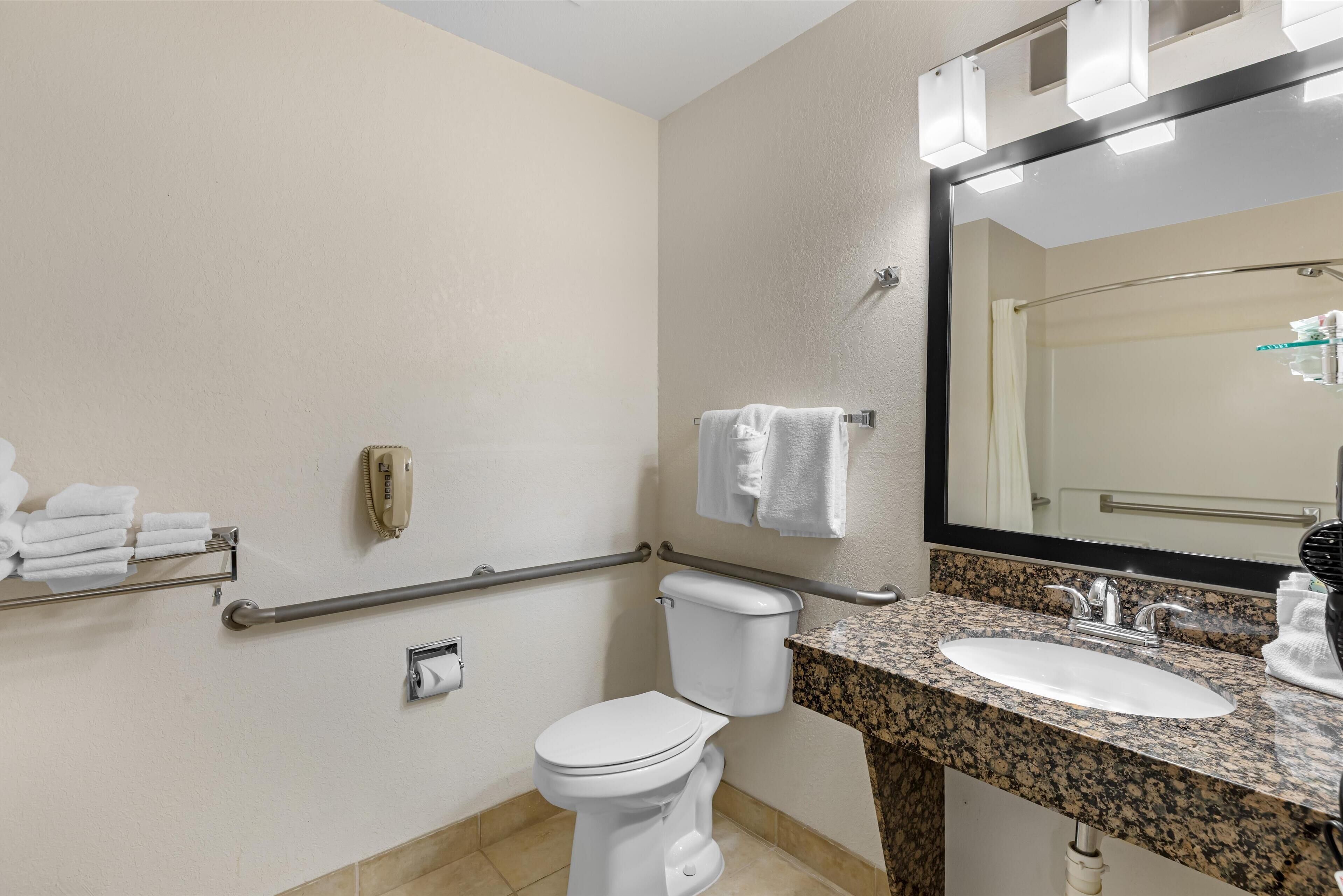 ada accessible roll-in-shower, deluxe one queen non-smoking, non pet friendly | bathroom | combined shower/bathtub, free toiletries, hair dryer, towels