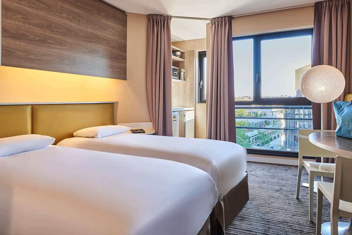 Standard Apartment, 2 Single Beds | In-room safe, desk, laptop workspace, soundproofing