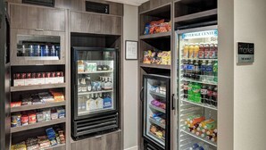 A beverage center with various drink options including sodas, juices, and alcoholic beverages. - Residence Inn by Marriott Kansas City Country Club Plaza (Kansas City)