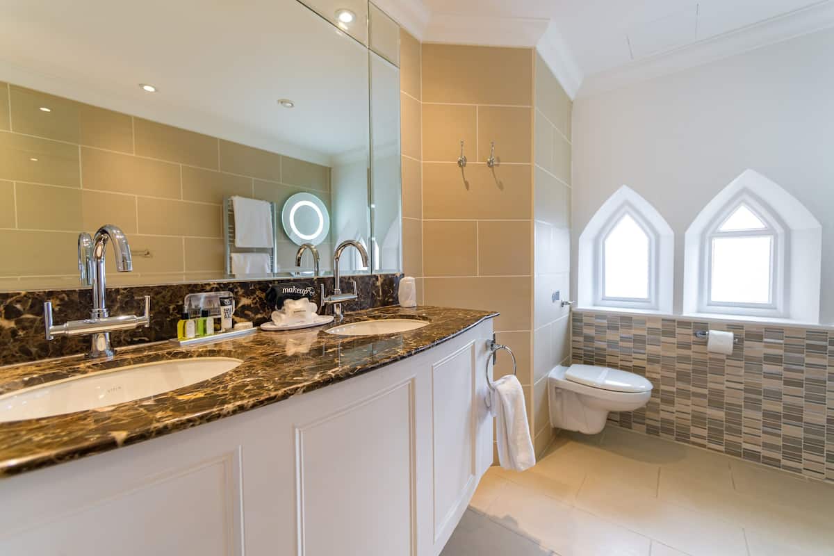 deluxe family room | bathroom | free toiletries, hair dryer, towels, soap