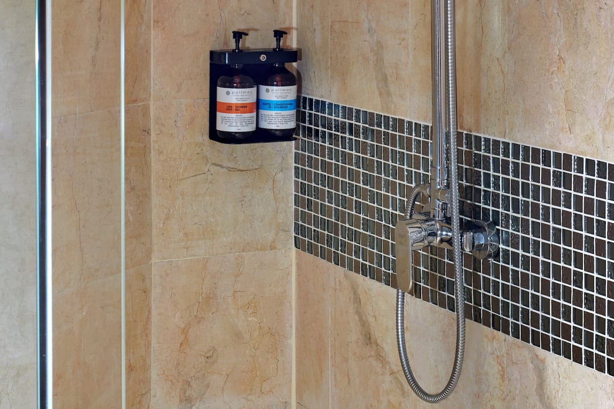 Separate bathtub and shower, eco-friendly toiletries, hair dryer