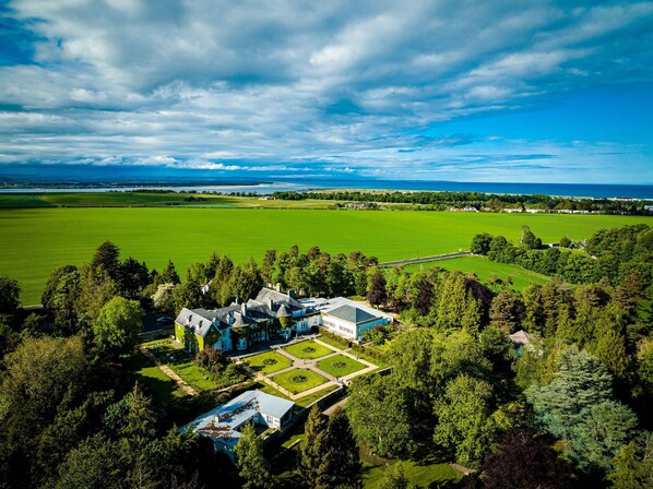 Experience the serenity of this historic estate, surrounded by lush gardens and expansive open spaces.
