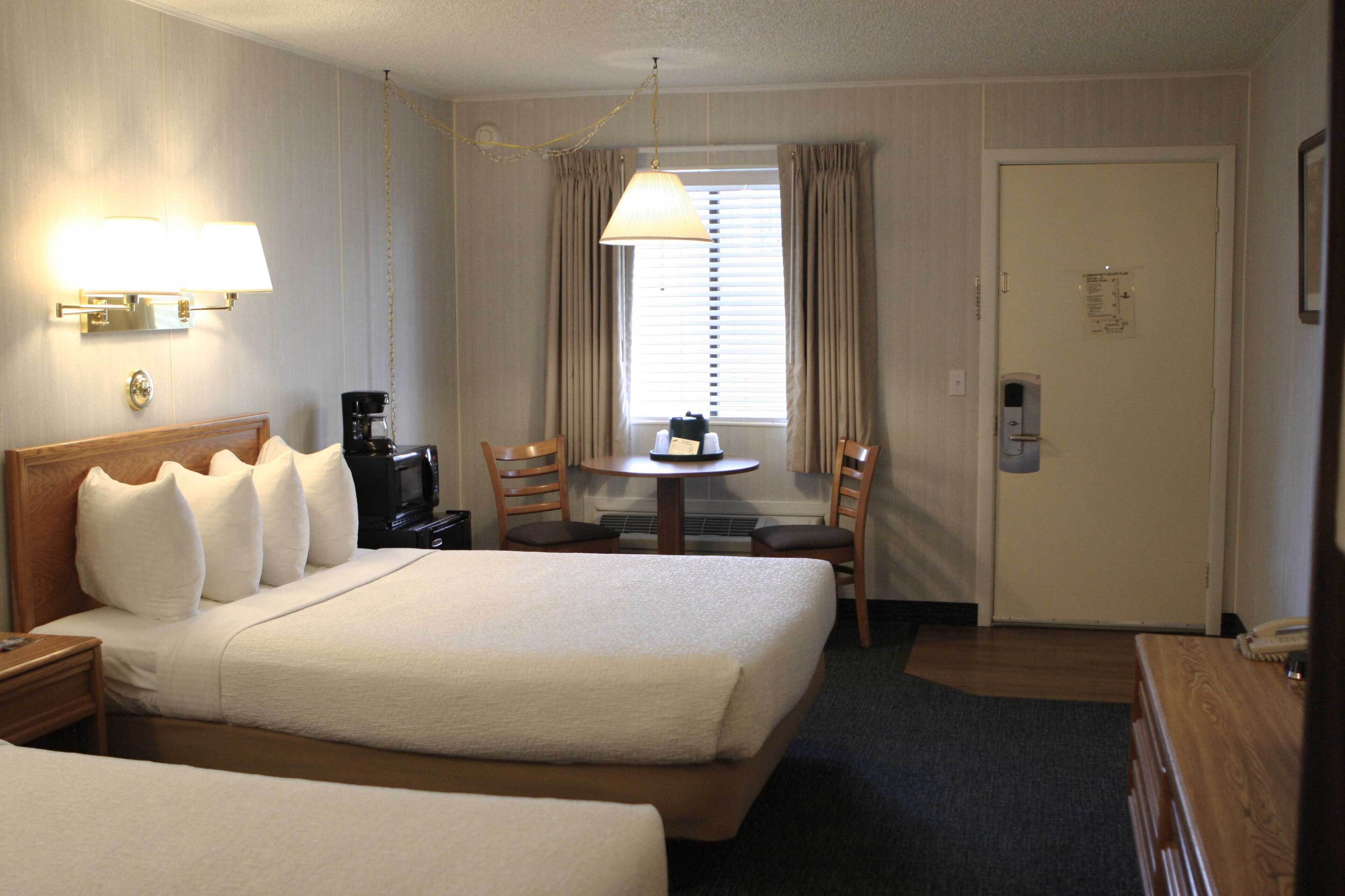 standard room, 2 queen beds | laptop workspace, iron/ironing board, travel cot, free wifi