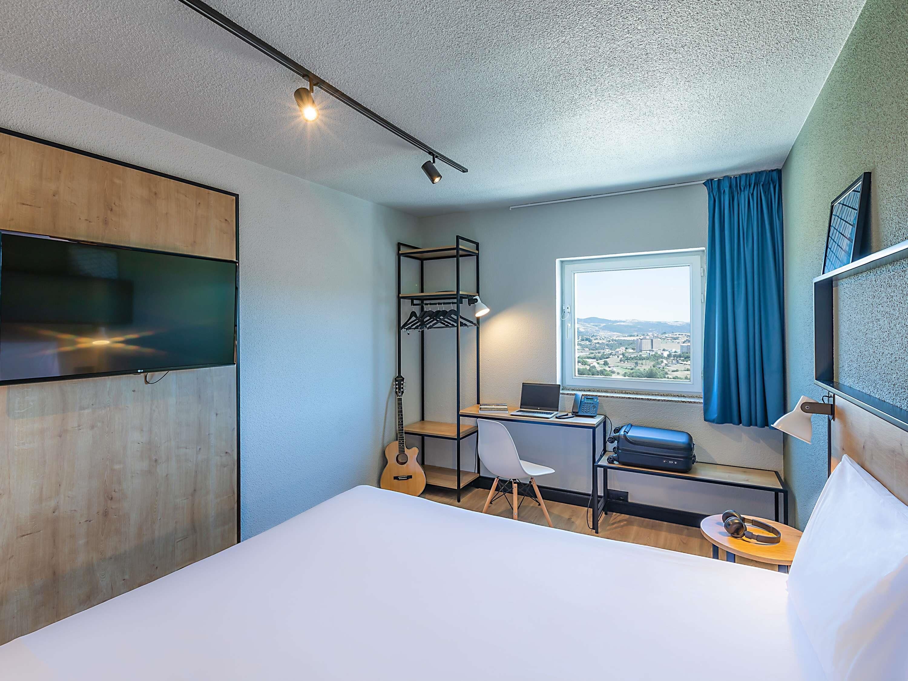 Desk, laptop workspace, blackout curtains, free WiFi