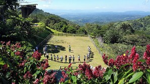 Guests can enjoy breathtaking views of the valley and distant mountains from this serene outdoor setting.