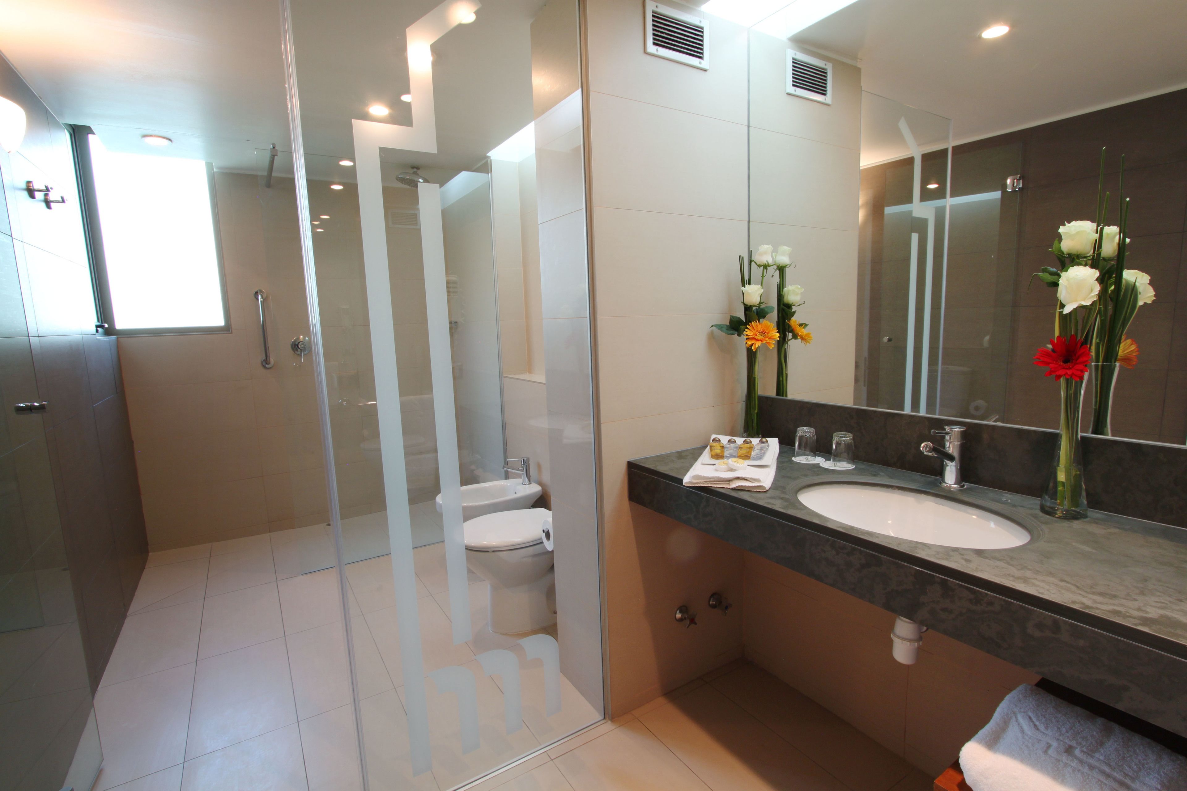 superior room | bathroom | rainfall showerhead, free toiletries, hair dryer, slippers