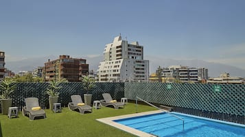Seasonal outdoor pool, pool loungers