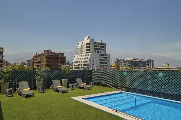 Seasonal outdoor pool, pool loungers