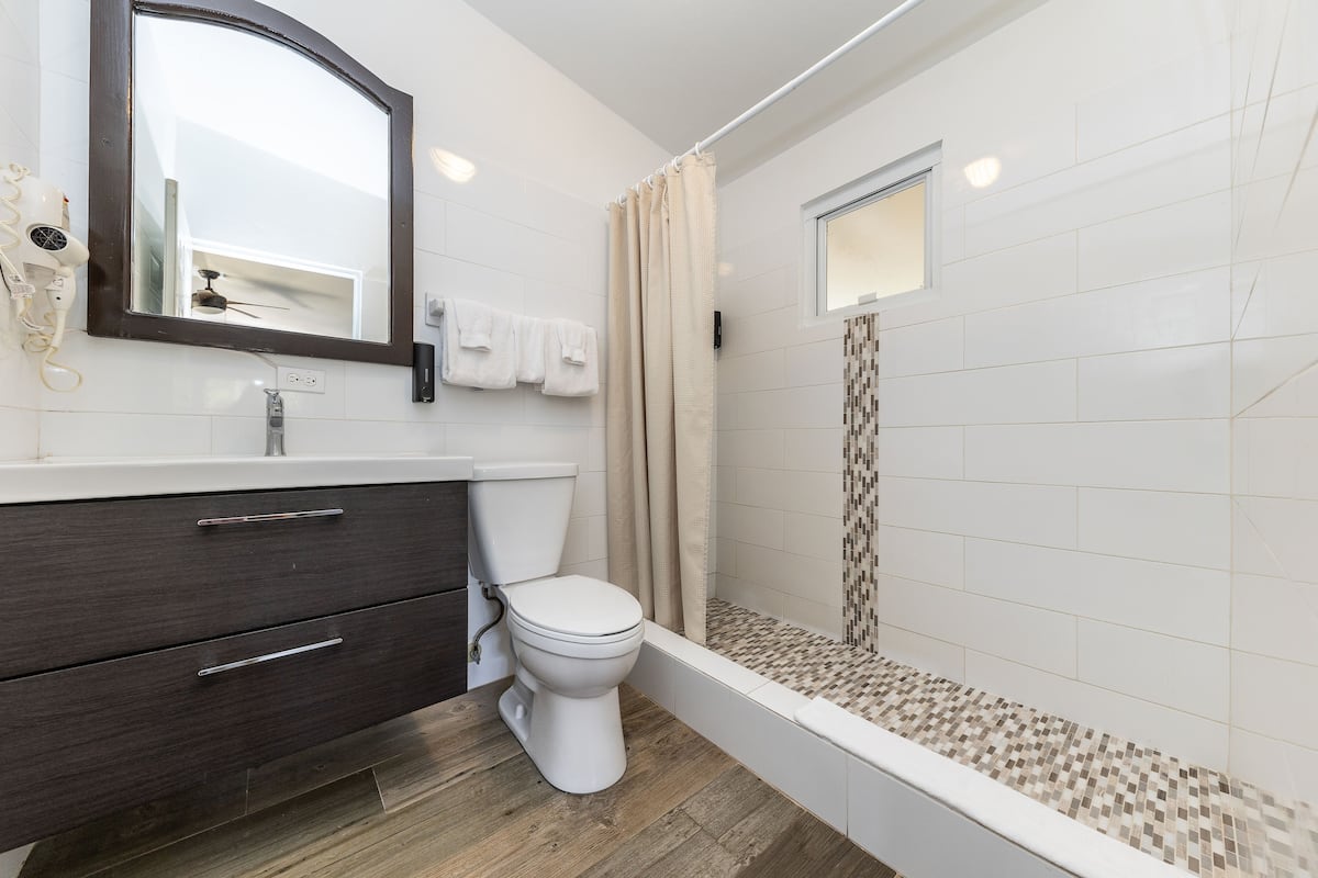 standard room, 2 queen beds | bathroom | shower, free toiletries, hair dryer, towels