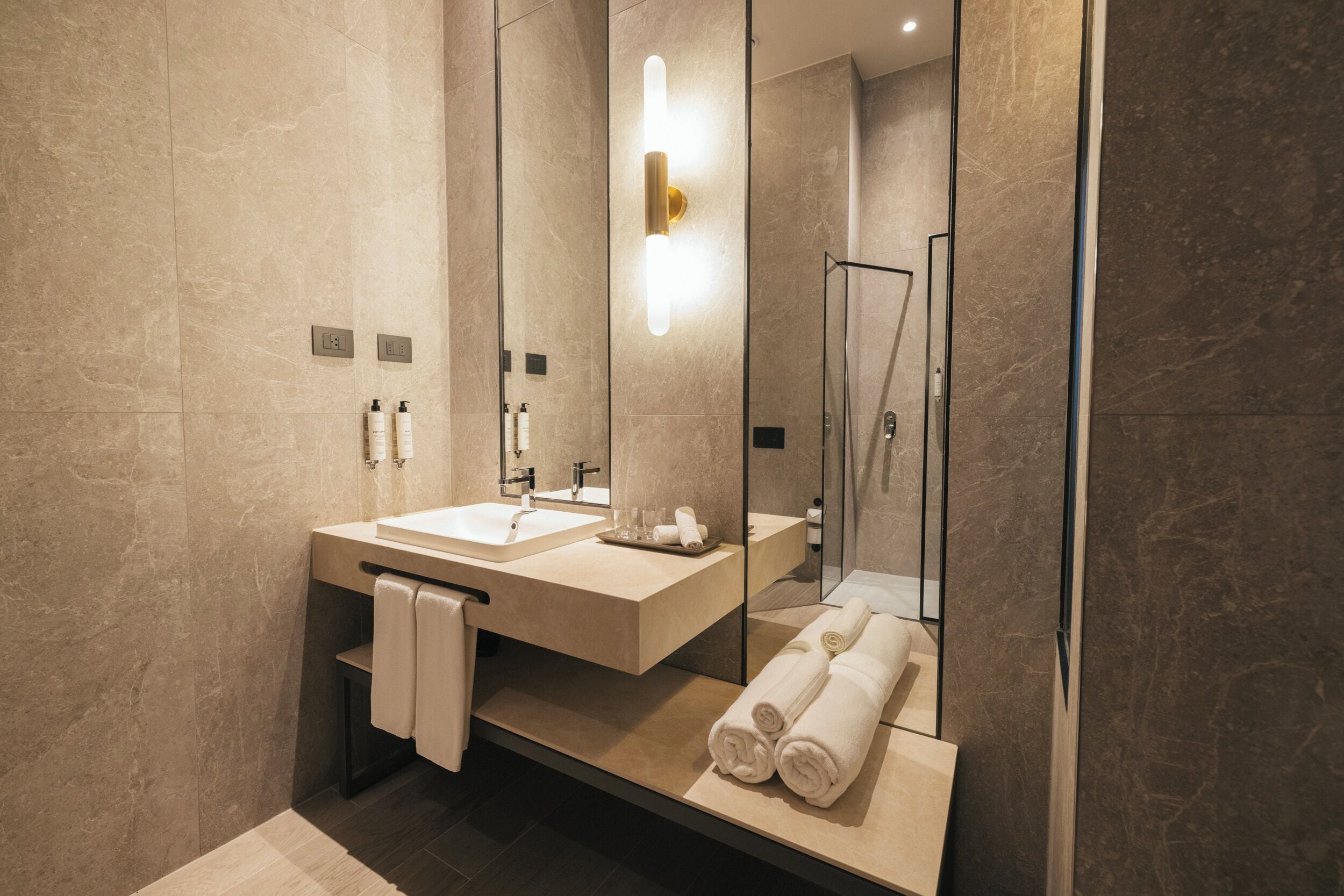 combined shower/bathtub, deep-soaking bathtub, designer toiletries