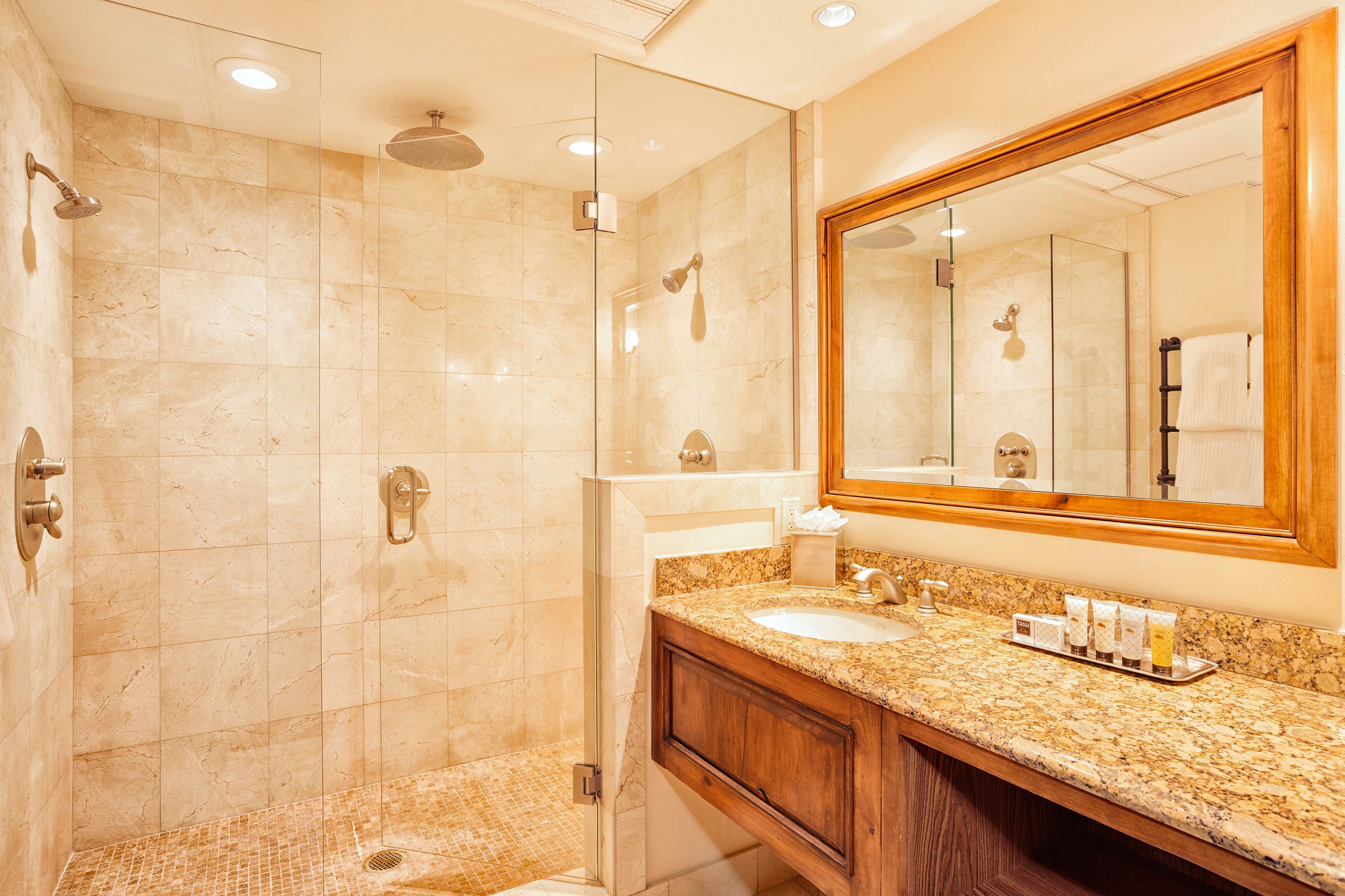 combined shower/bathtub, designer toiletries, hair dryer, bathrobes