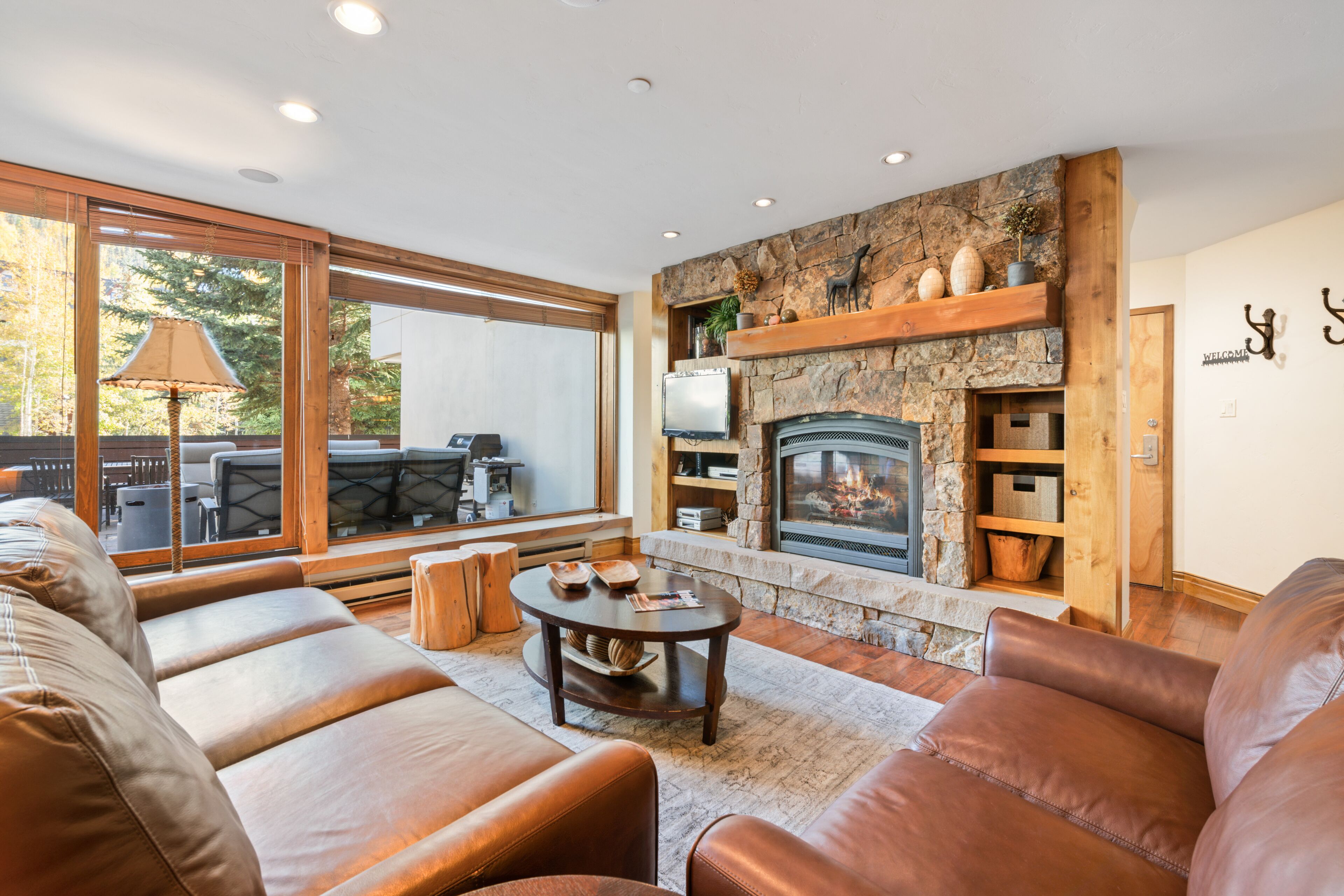 Luxury Condo, 2 Bedrooms | Living area | Flat-screen TV, fireplace, DVD player, books