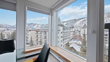 Luxury Condo, 3 Bedrooms | Living area | Flat-screen TV, fireplace, DVD player, books