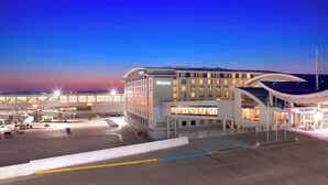 A modern airport terminal with a Westin hotel.