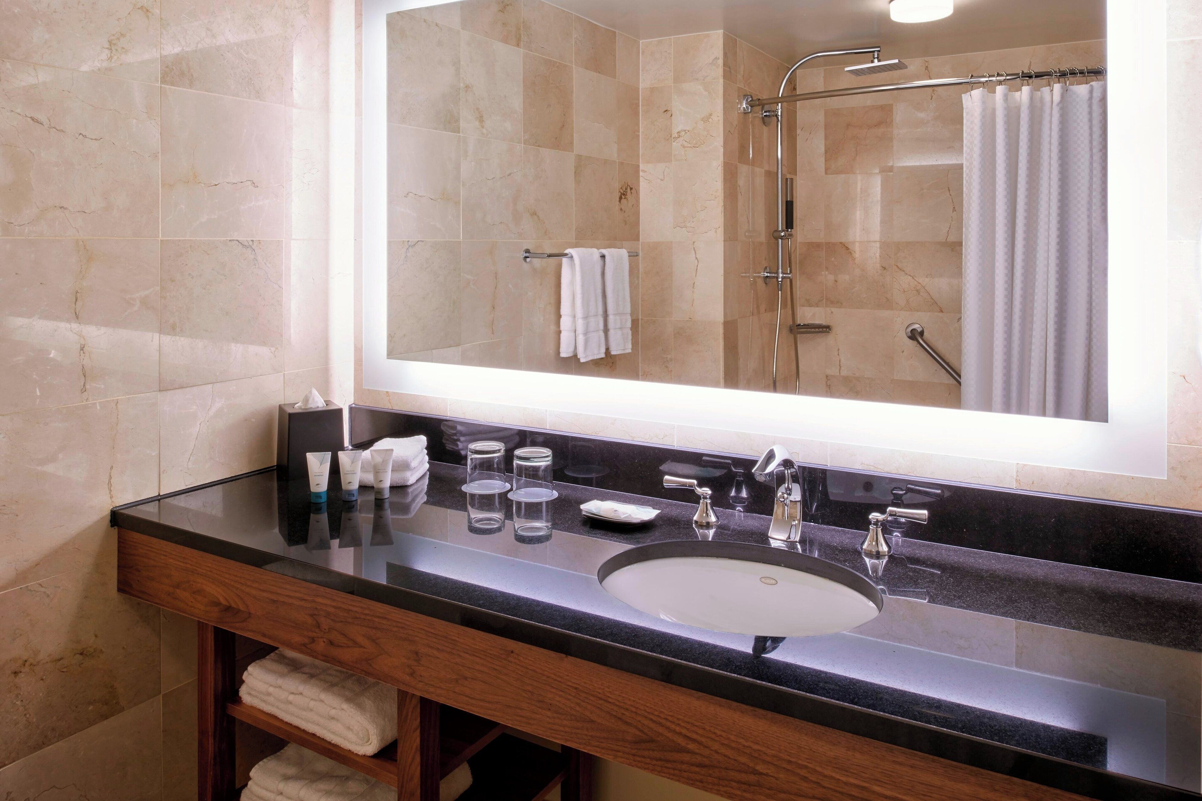 combined shower/bathtub, deep-soaking bathtub, designer toiletries