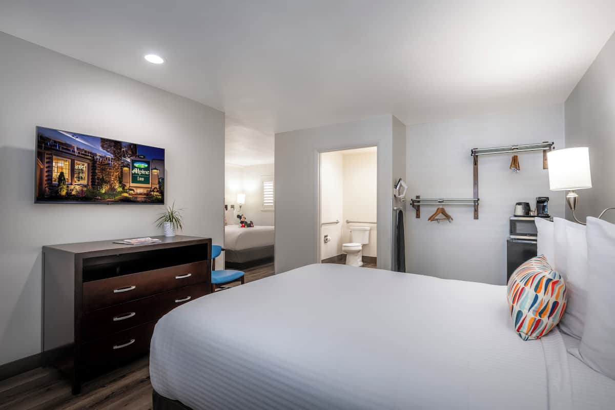 Standard Room, 2 Queen Beds, Mobility Accessible | Desk, laptop workspace, iron/ironing board, cribs/infant beds