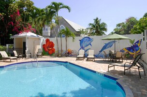A heated pool, sun loungers