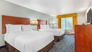 A hotel room with two beds, a desk, a television, and a window with curtains. - Best Western Plus Villa Del Lago Inn Patterson (Patterson)
