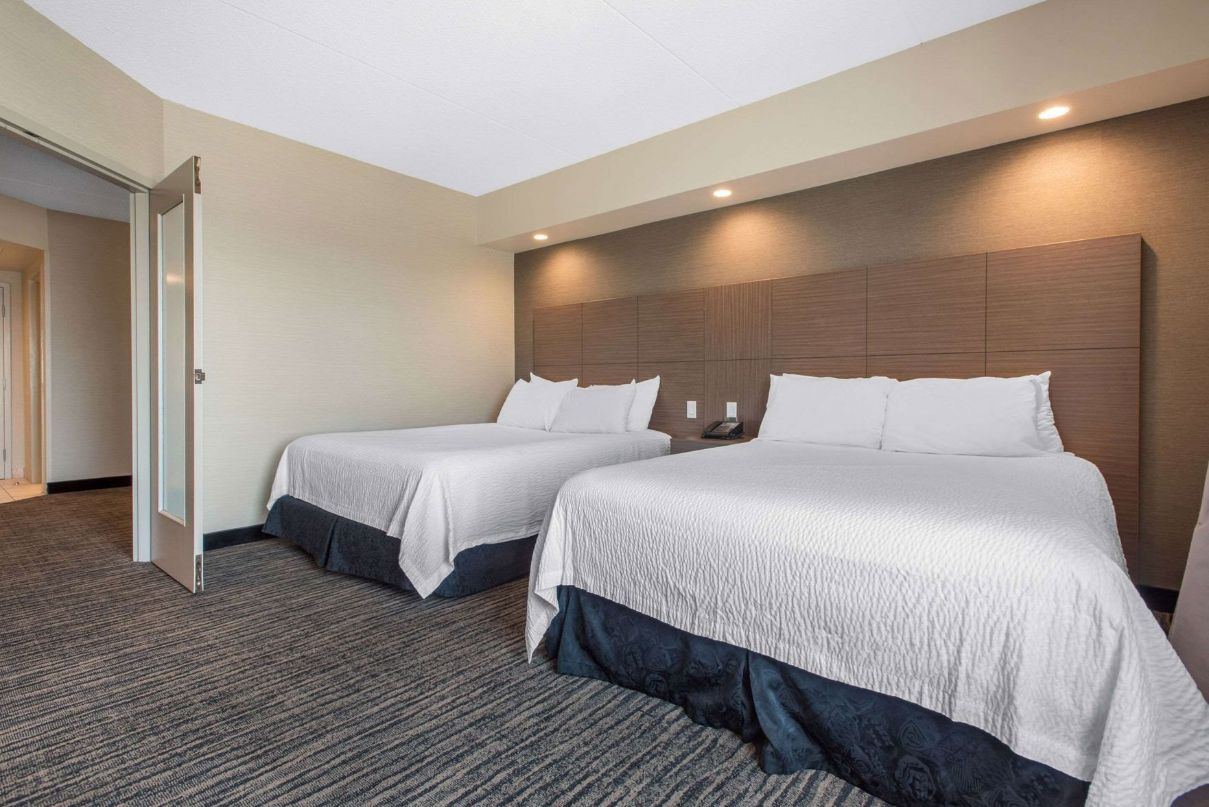 Pillowtop beds, desk, blackout drapes, iron/ironing board