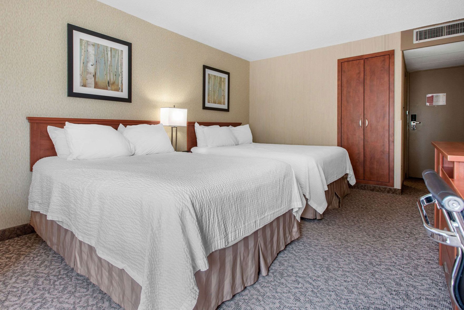 Pillowtop beds, desk, blackout drapes, iron/ironing board