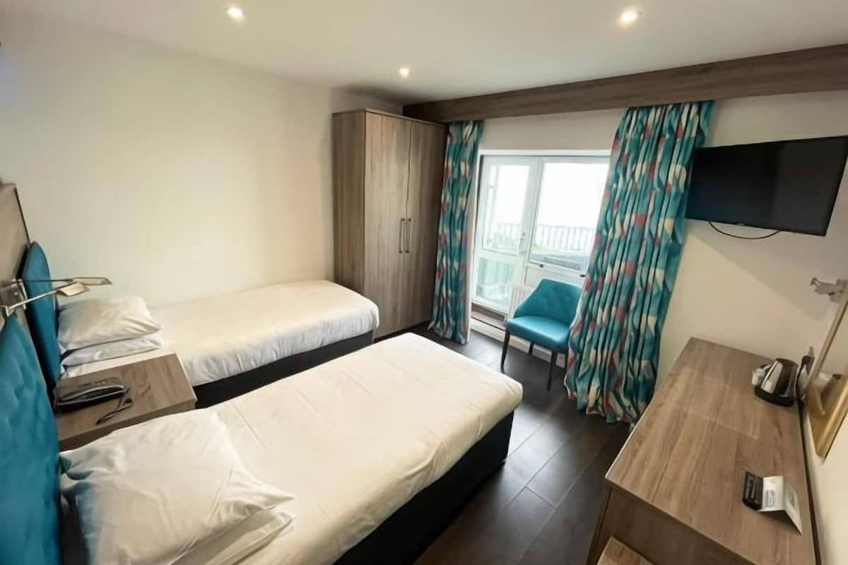 Desk, iron/ironing board (on request), WiFi (free), bed sheets