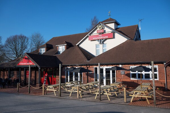A building with a sign reading "Hungry Work The Weathervine." - Weathervane Hotel by Greene King Inns (Stoke-on-Trent)