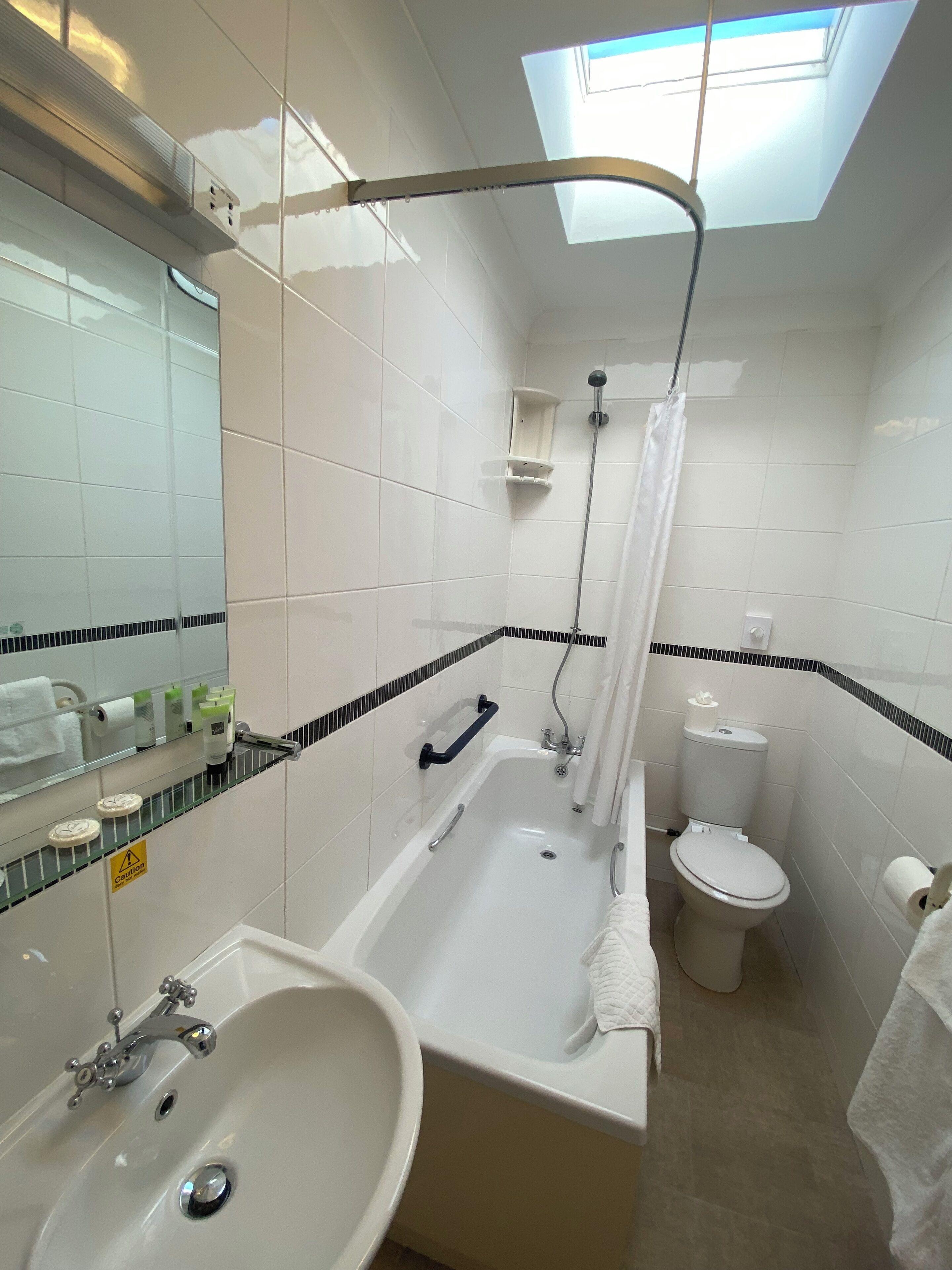 family room | bathroom | combined shower/bathtub, free toiletries, hair dryer, towels