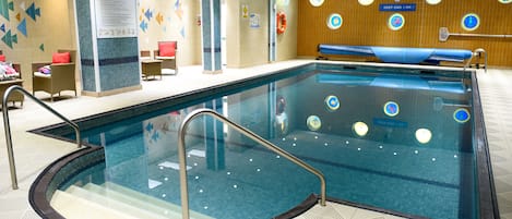 Indoor pool, open 7 AM to 9 PM, pool loungers