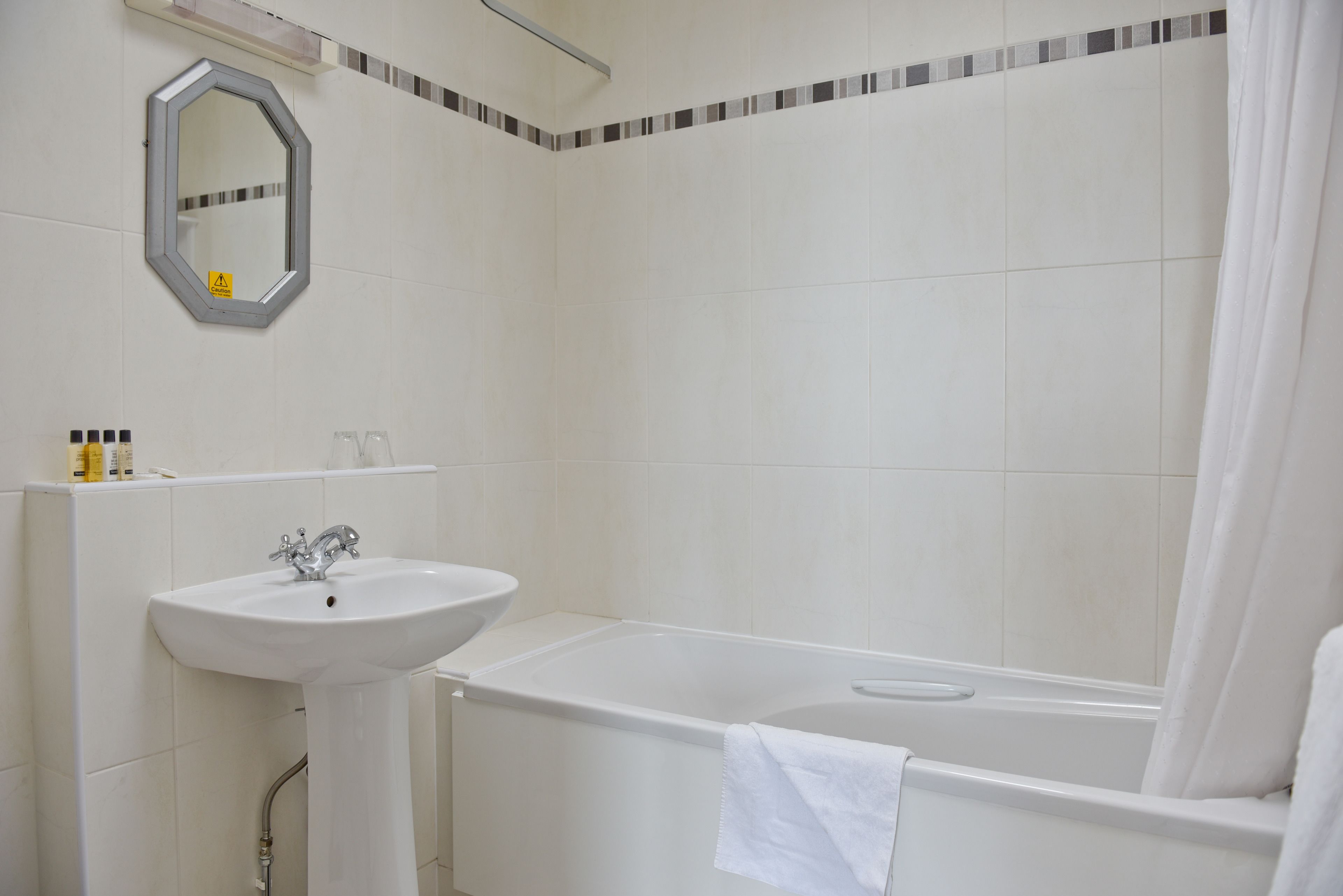 combined shower/bathtub, free toiletries, hair dryer, towels