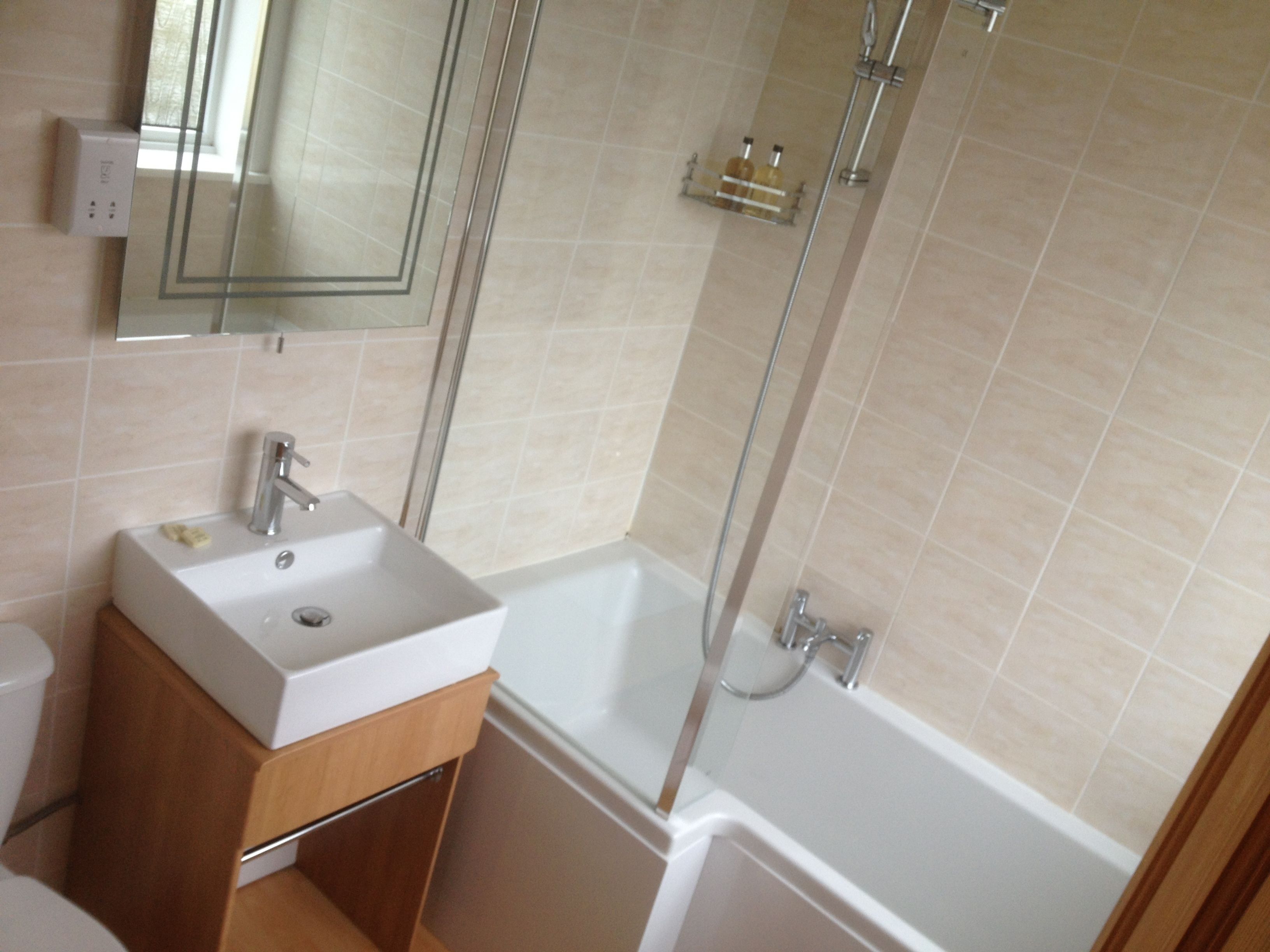 standard double room | bathroom | shower, hair dryer, towels, soap