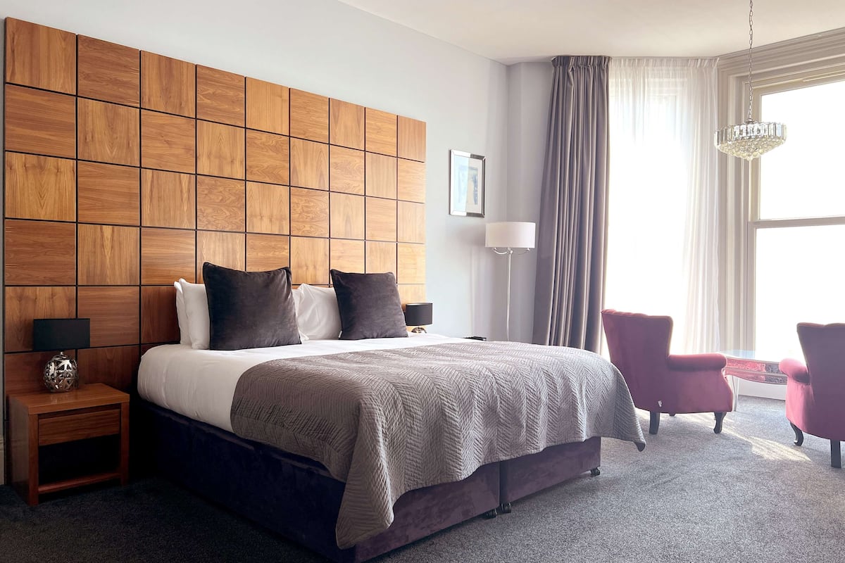 junior suite | premium bedding, in-room safe, desk, iron/ironing board