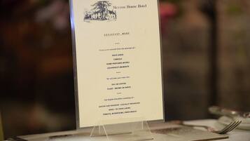 A breakfast menu at Meryam House Hotel, including options like fruit juice, cereals, and tea or coffee.
