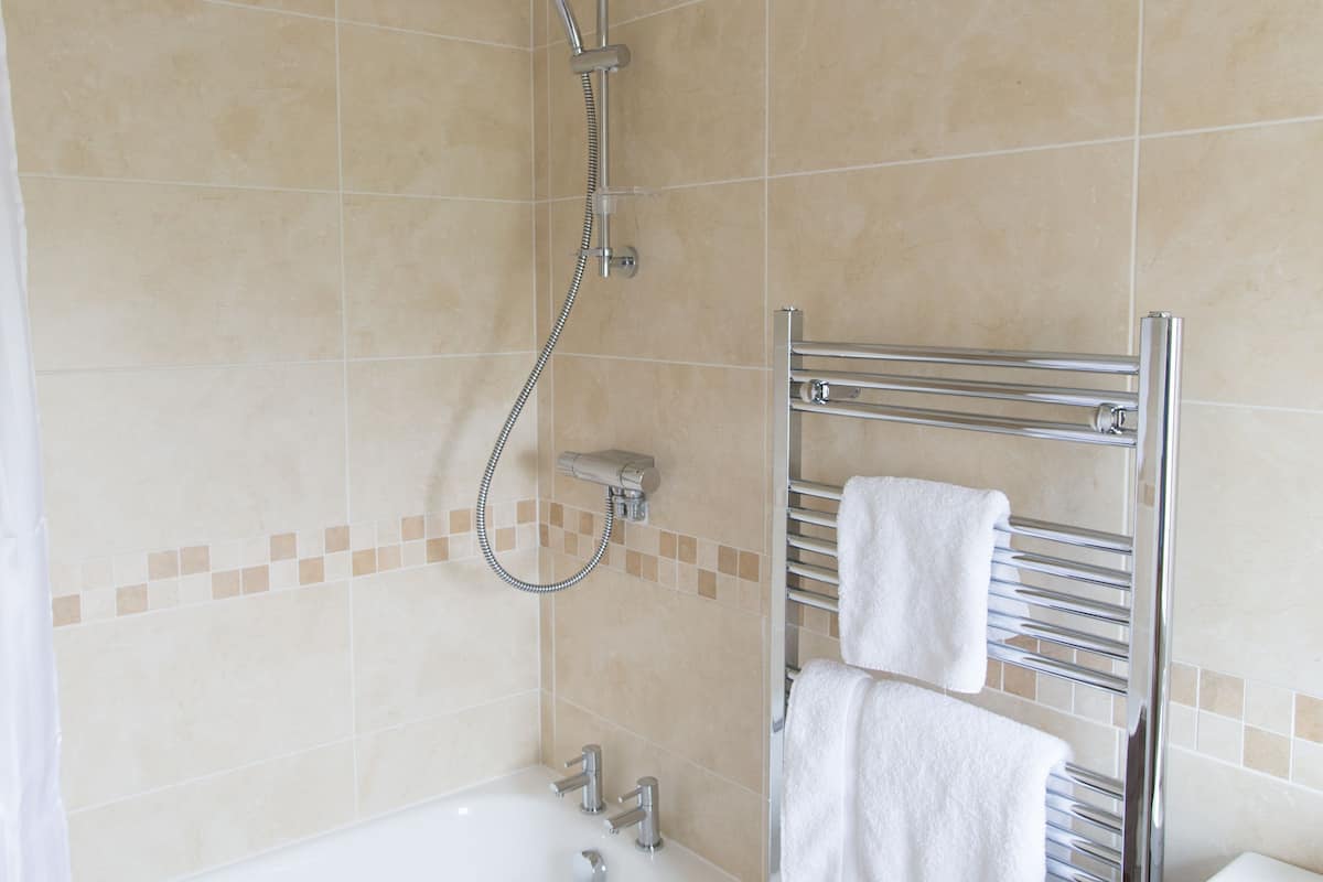 double room, 1 king bed | bathroom | shower, free toiletries, hair dryer, towels