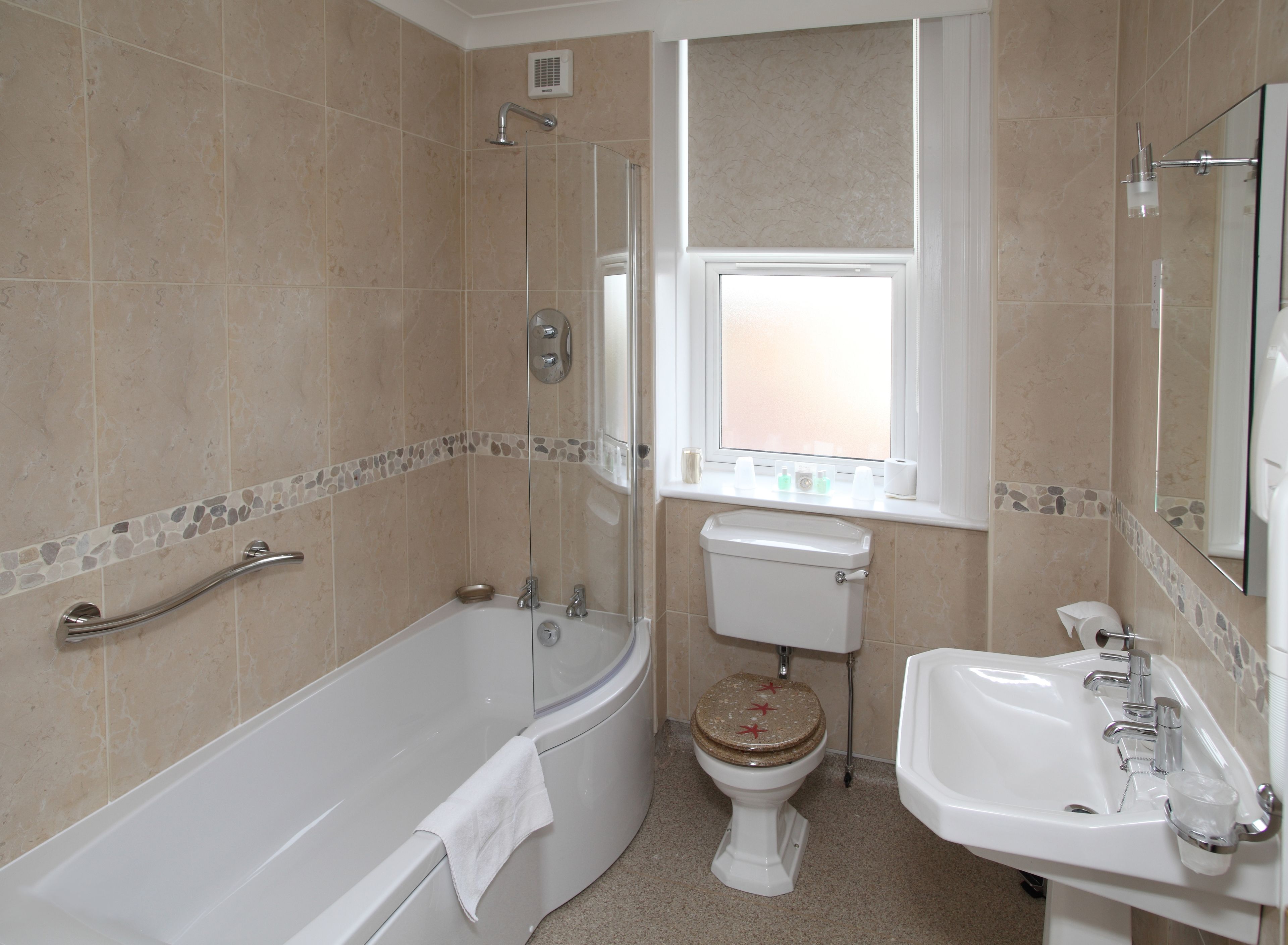 deluxe double room, 1 king bed | bathroom | shower, free toiletries, hair dryer, towels