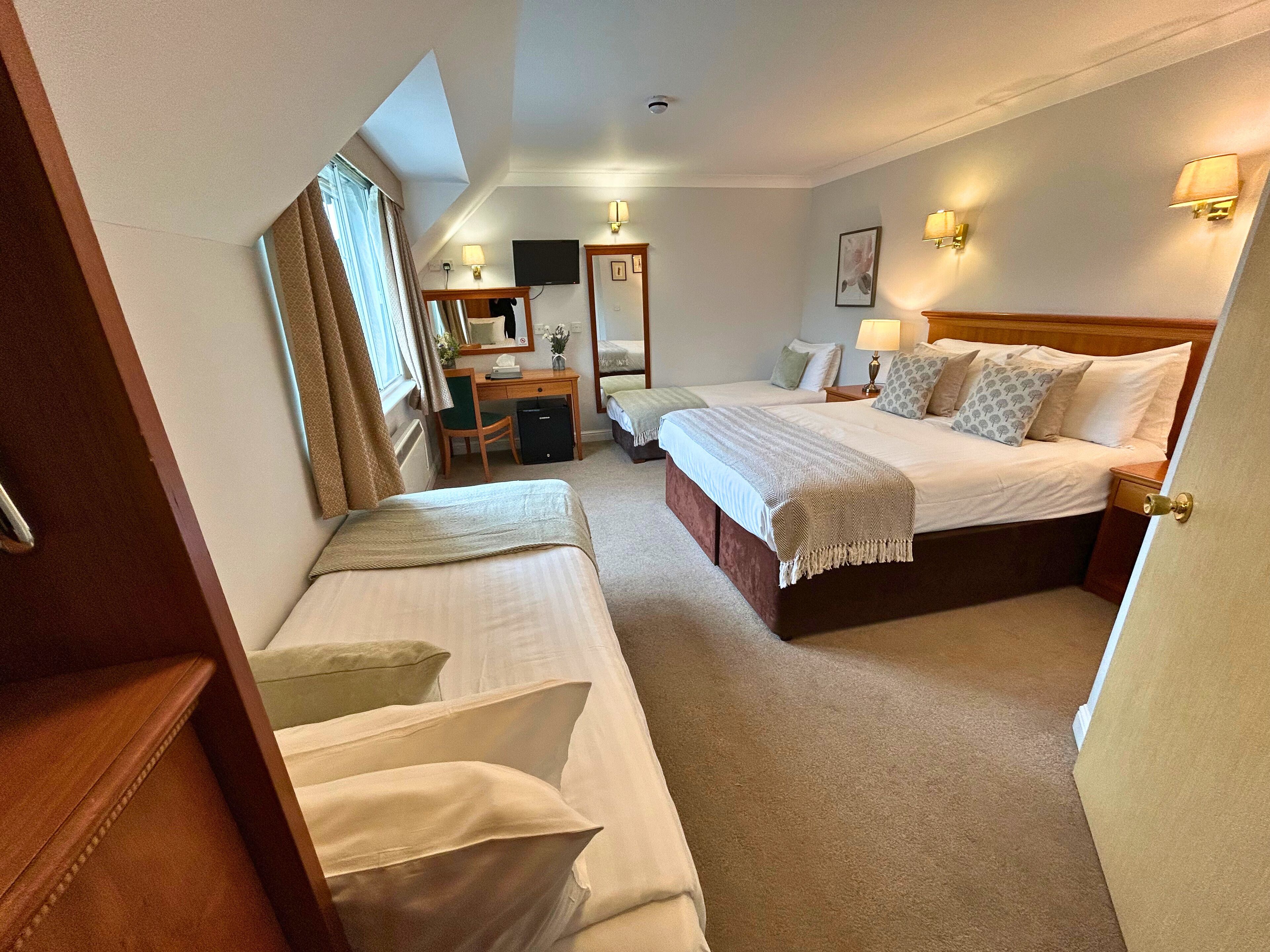 deluxe room | premium bedding, desk, laptop workspace, iron/ironing board