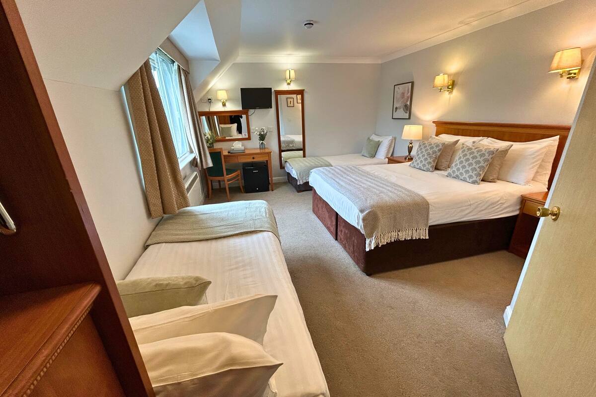 deluxe room | premium bedding, desk, laptop workspace, iron/ironing board