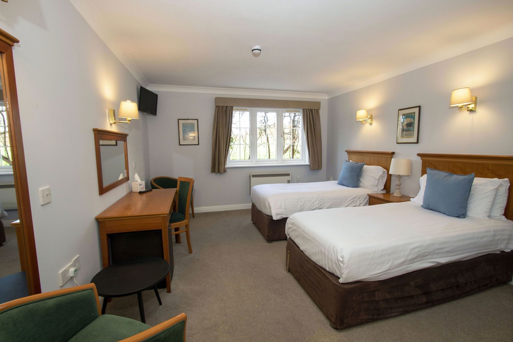 Premium bedding, desk, laptop workspace, iron/ironing board